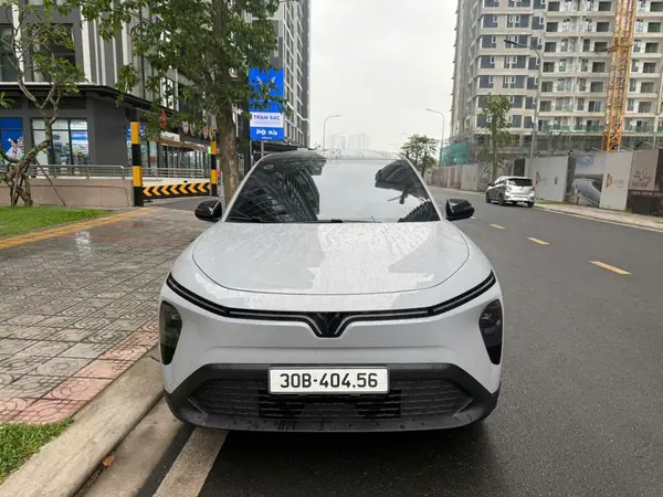 A white VinFast parked on a Hanoi street