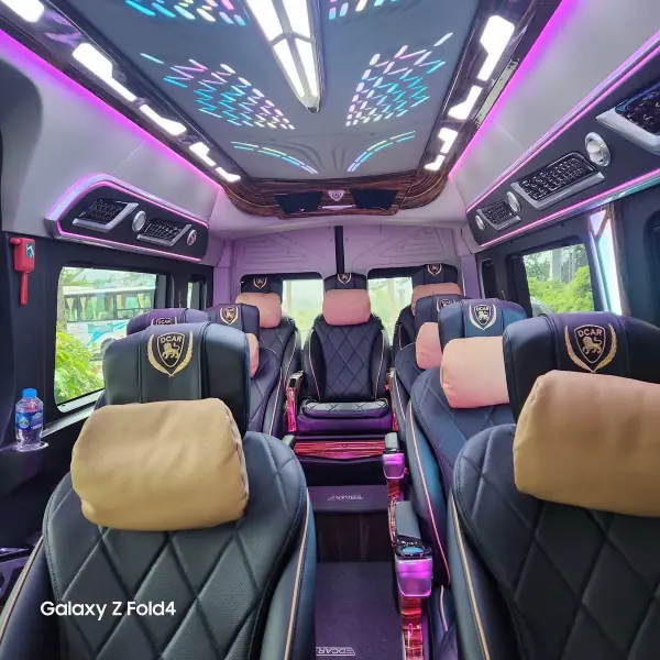 Limousine cabin with reclining massage seats and soft lighting