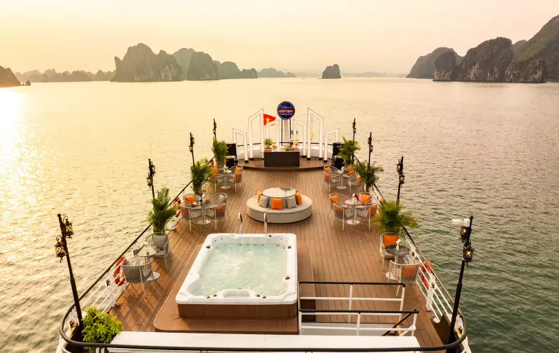 Cruise sundeck at sunset facing the islands of Ha Long Bay