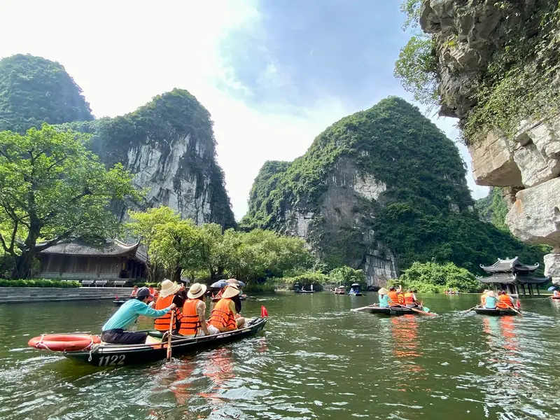 Rowing boats between limestone peaks in Trang An